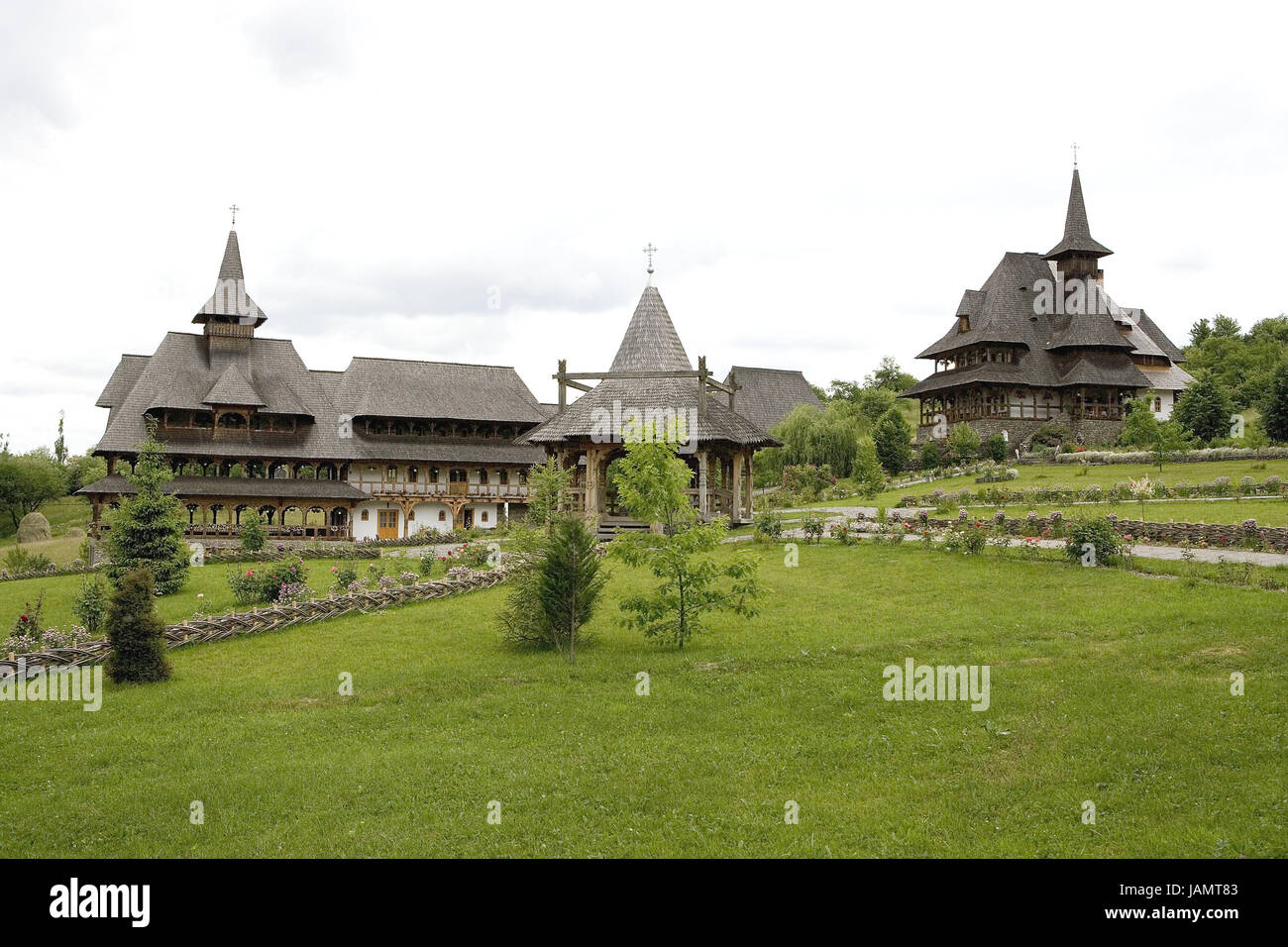 Romania,region of Maramures,Barsana,cloister attachment,destination,place of interest,cloister,faith,religion,Christianity,orthodox,architecture,building,houses,timber-frame construction way,meadow,outside,deserted,churches,churches,sacred setting, Stock Photo