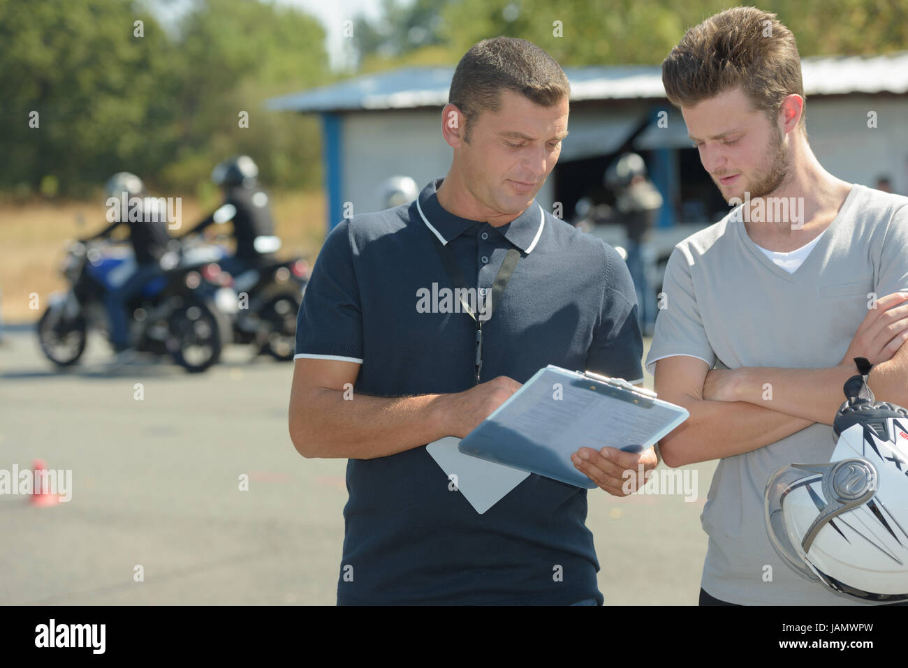motorcyclist has driving test in moto school for drivers license Stock Photo