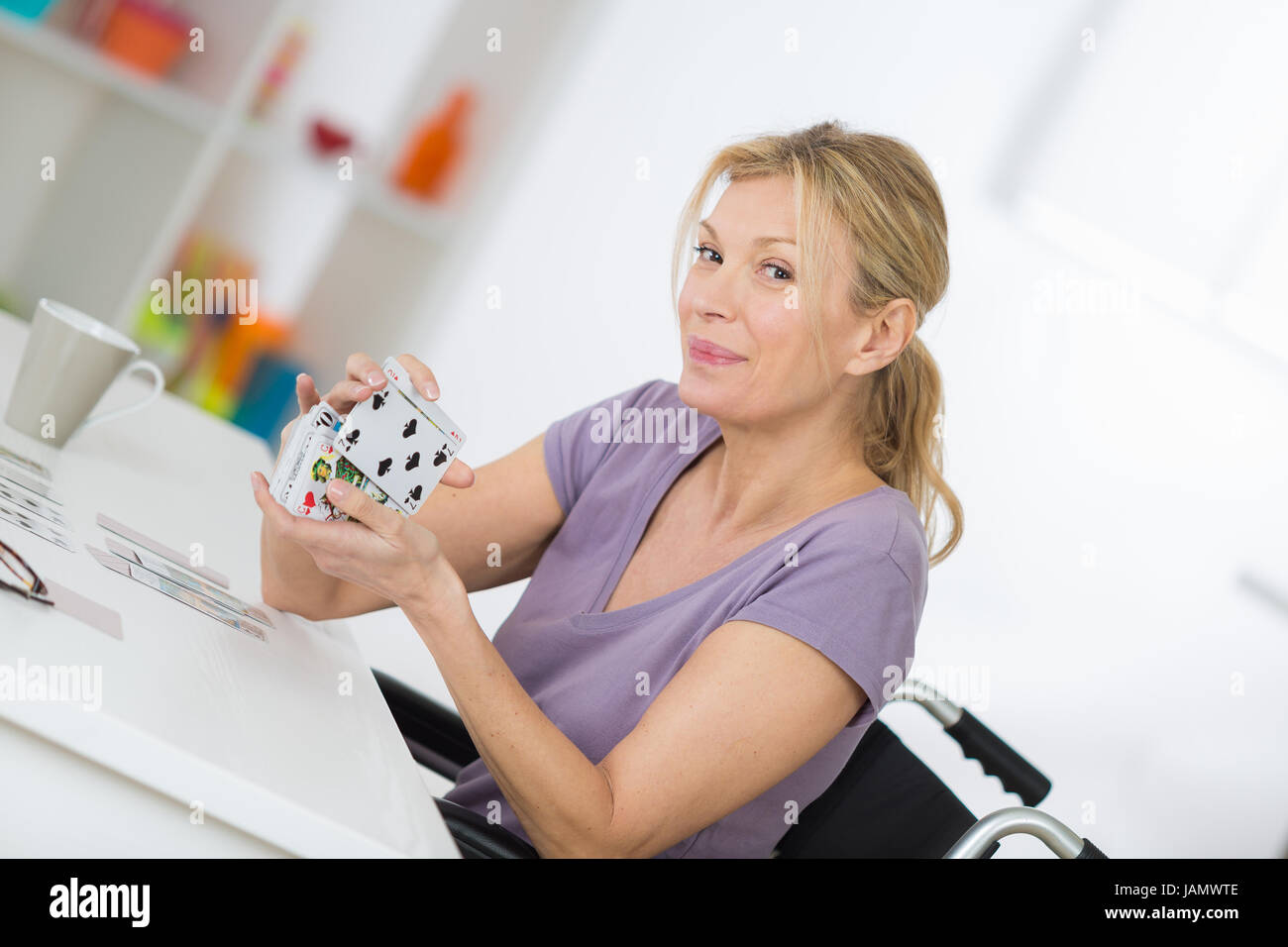 smiling woman in a wheelchair Stock Photo - Alamy
