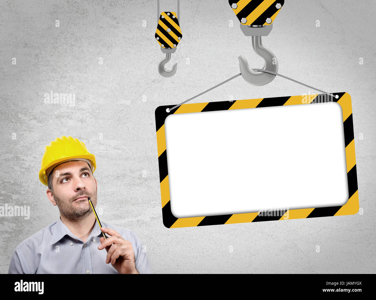 Engineer with a helmet on his head, reflecting staring into the void holding a pencil under her nose Stock Photo