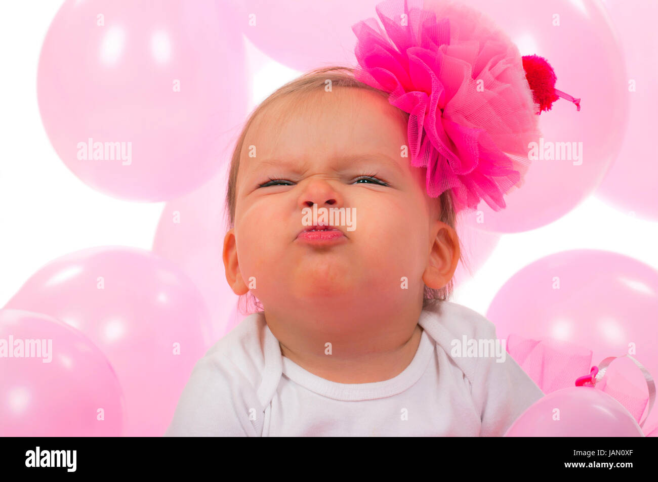 Birthday baby making ugly face expression Stock Photo - Alamy