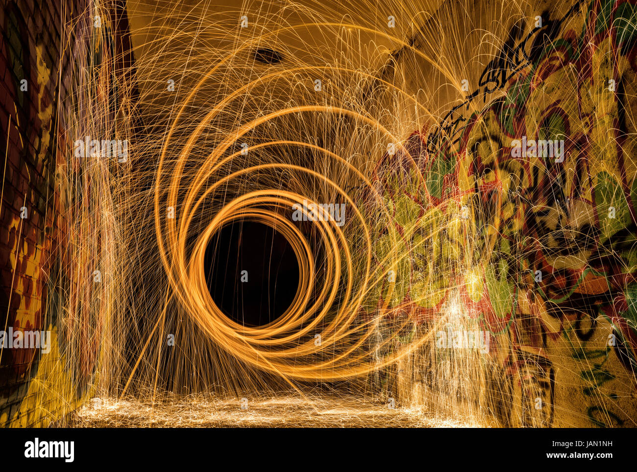 Steel wool vortex spiral light painting in the tunnel Stock Photo
