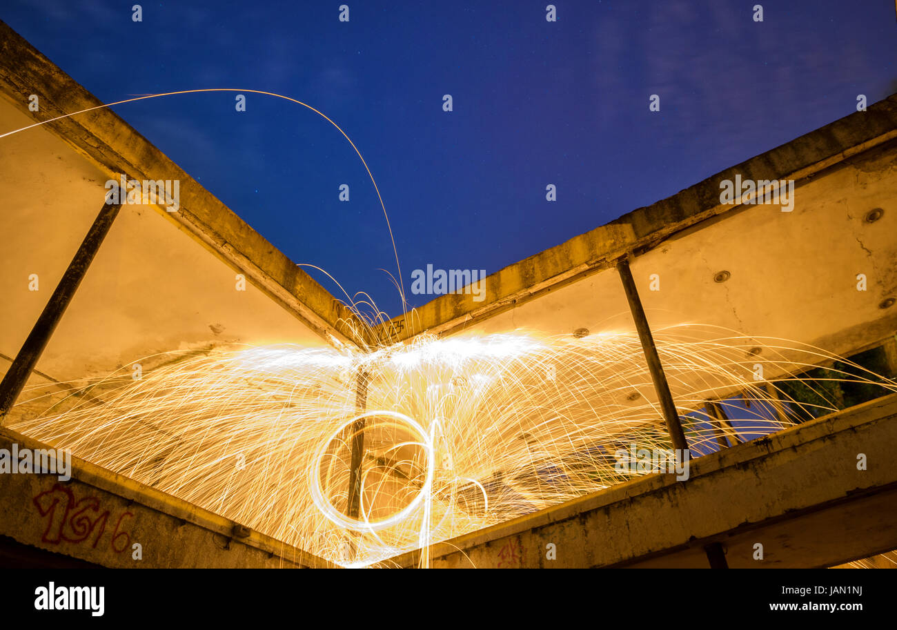 Steel wool vortex spiral light painting in the tunnel Stock Photo