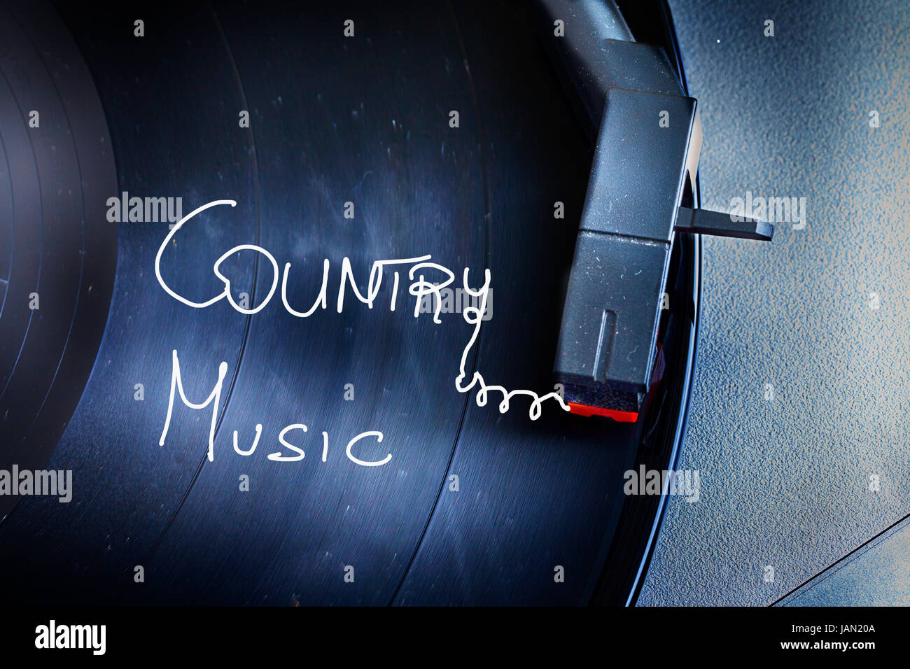 Old and dusty turntable with old vynil seen from above with words 'Country music' Stock Photo