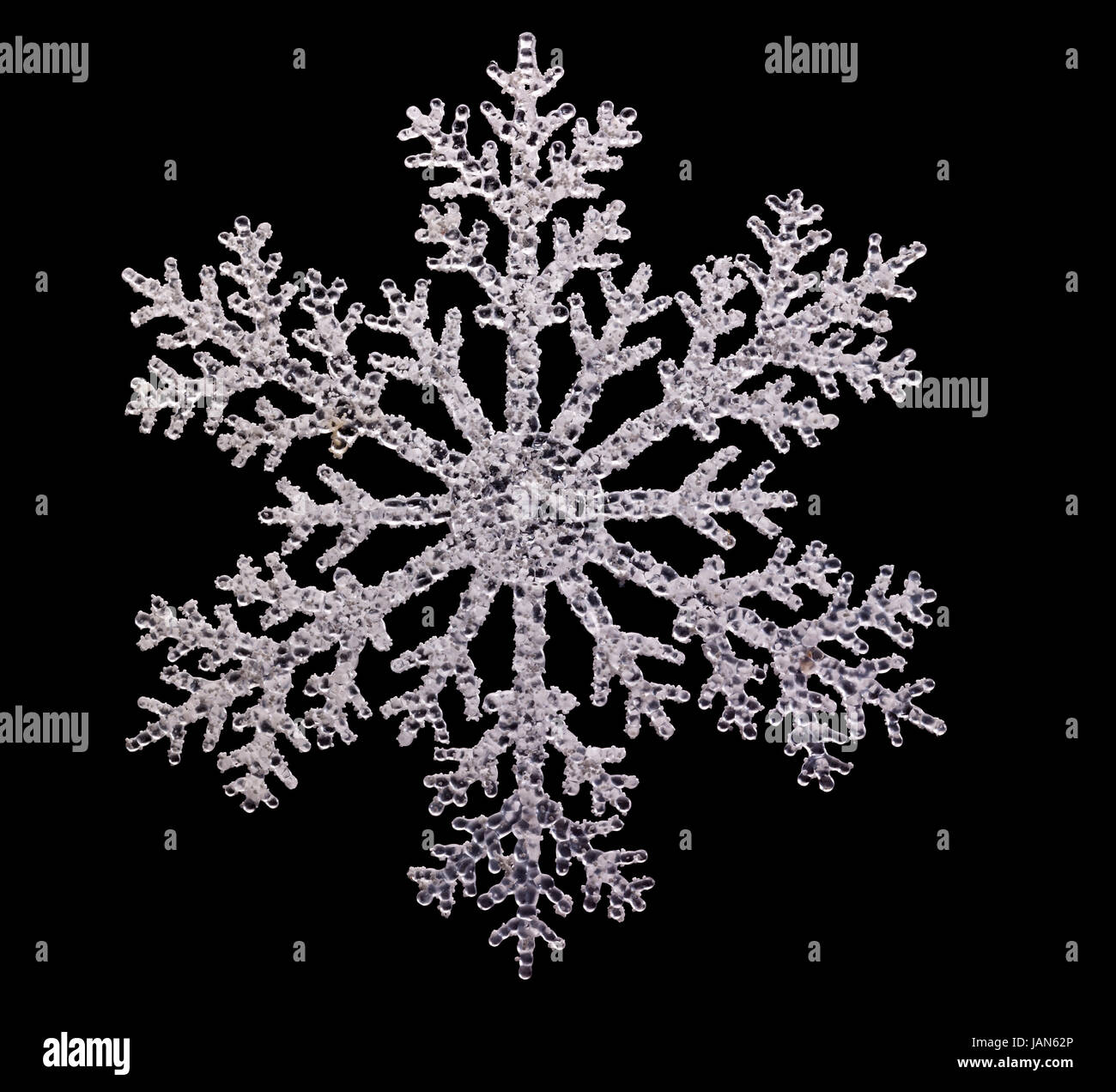 artificial clear snowflake isolated in black back Stock Photo