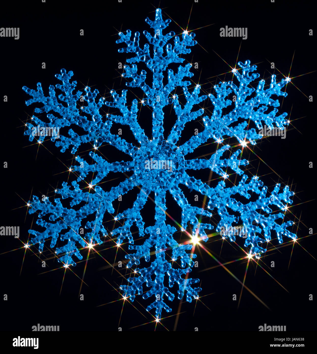 blue illuminated artificial snowflake with lots of twinkling light