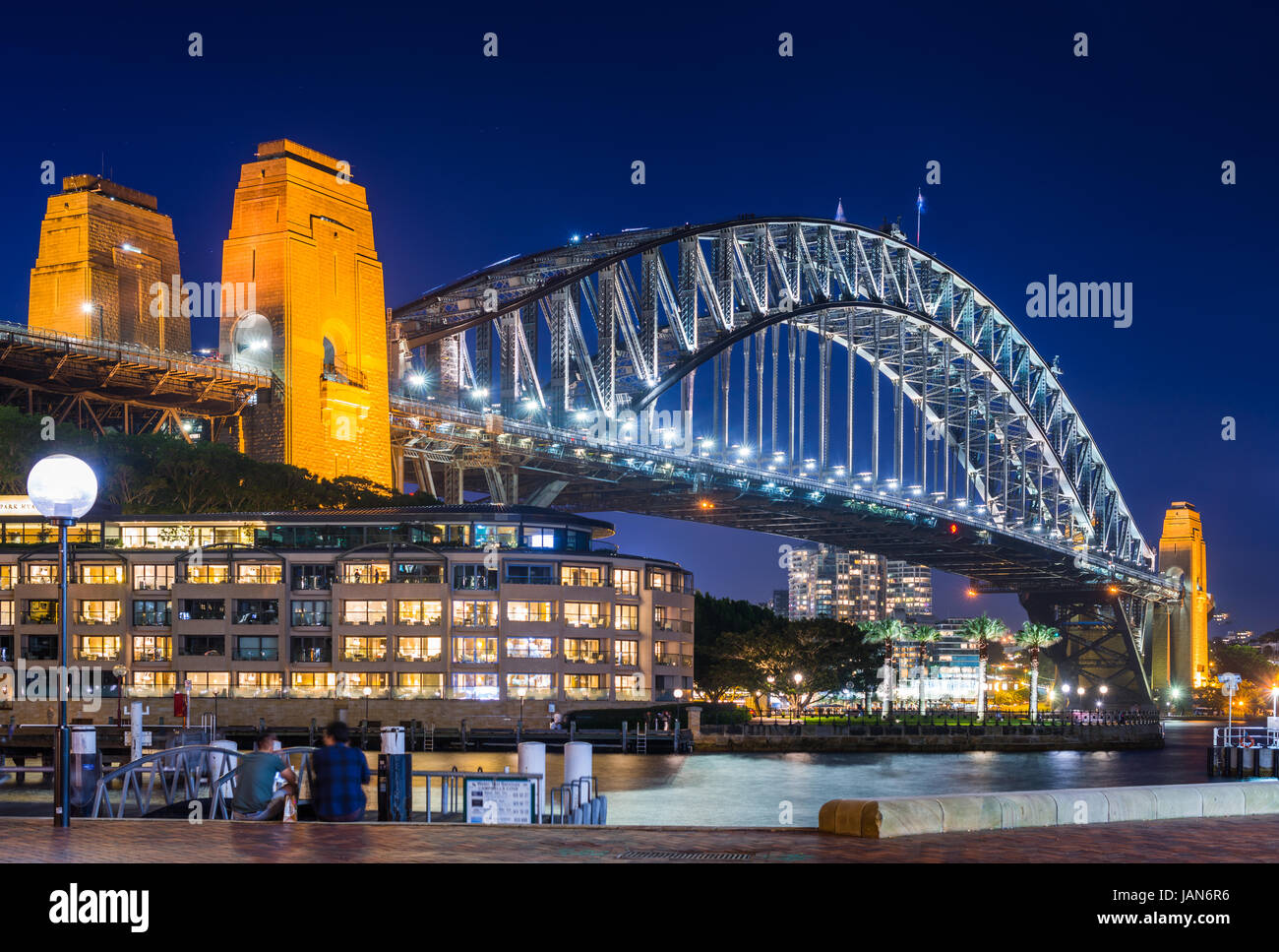 Sydney Harbour Bridge with Hyatt Park Hotel at dusk. Sydney, NSW, Australa. Stock Photo
