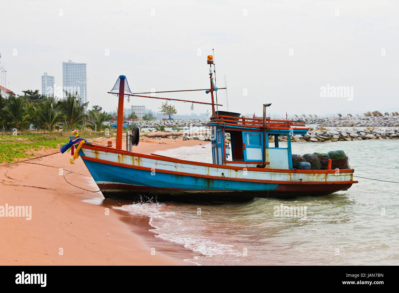 Wooden fishing boat on the beach Stock Photo - Alamy