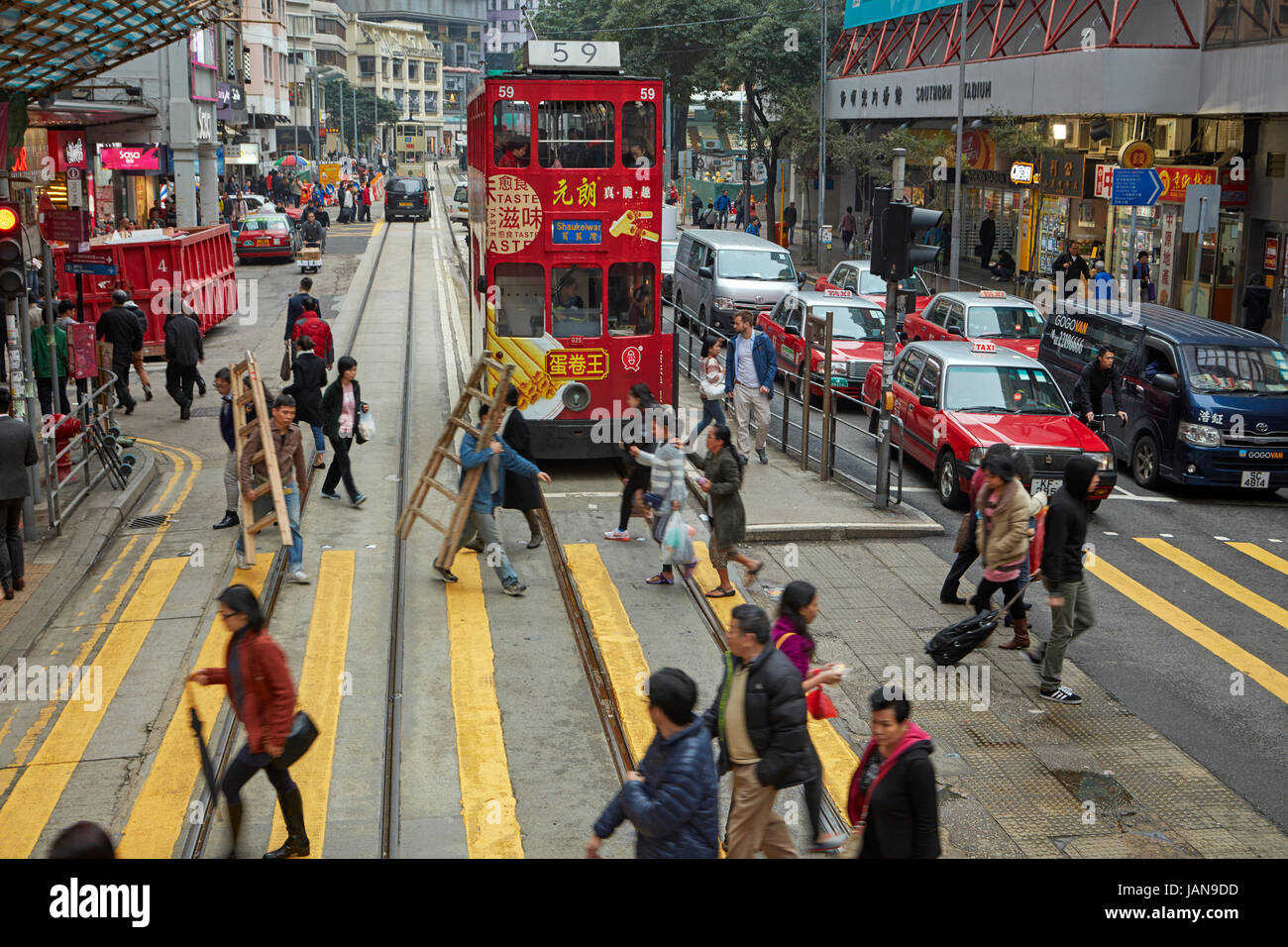 Pedestrians, traffic and trams, Johnston Road, Wan Chai, Hong Kong Island, Hong Kong, China Stock Photo