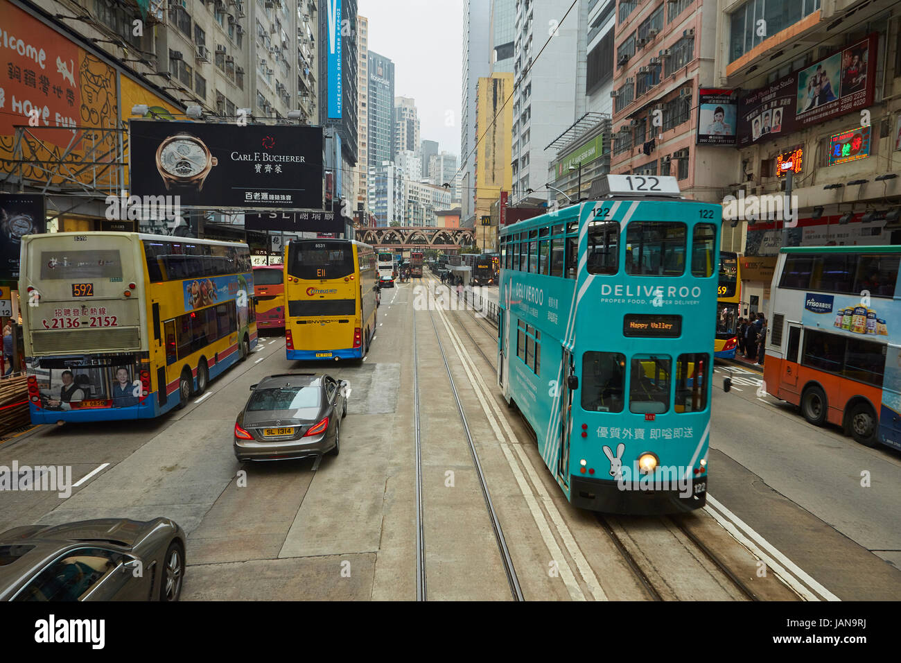 Double-decker tram and traffic, Hennessy Road, Causeway Bay, Hong Kong Island, Hong Kong, China Stock Photo