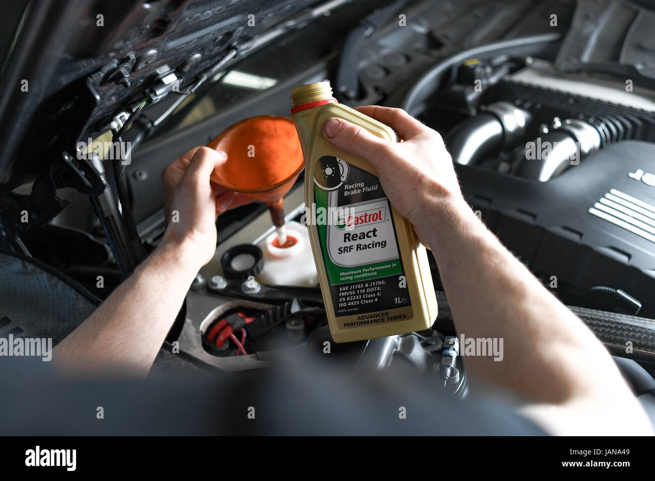 Brake fluid being toppled up on BMW M3 after brake pad change Stock Photo Alamy