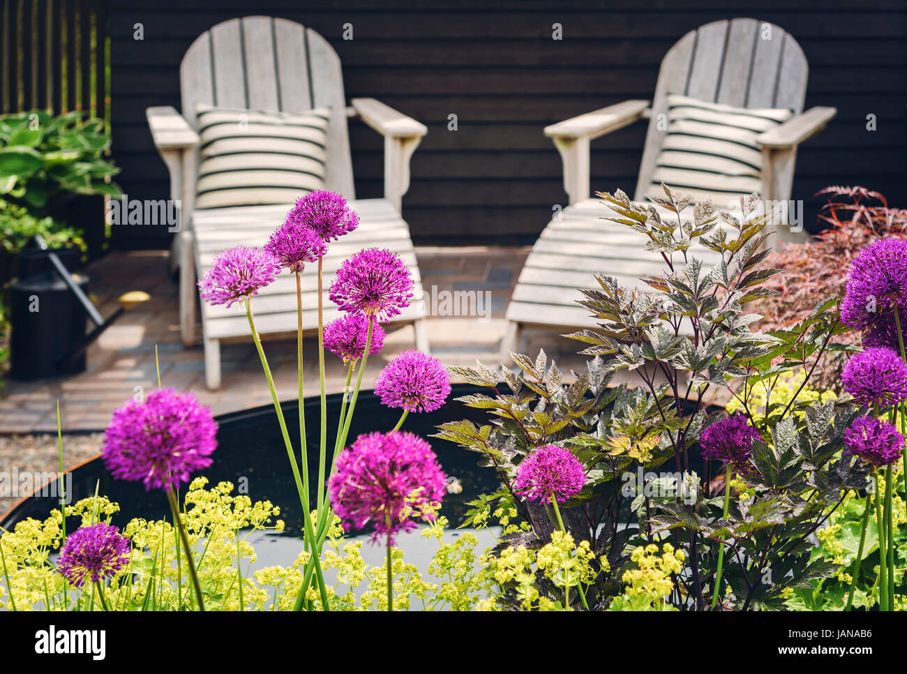 Cozy lounge furniture on landscaped garden terrace Stock Photo Alamy