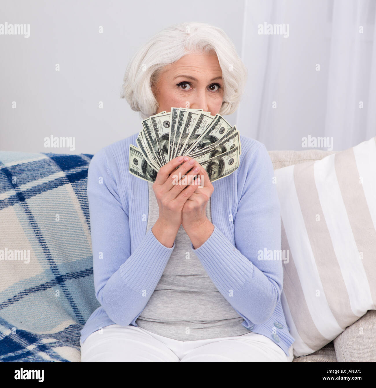 Elderly woman with money Stock Photo