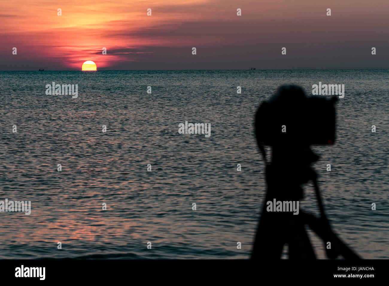 Camera on a tripod to take pictures of the sun and landscape Stock ...
