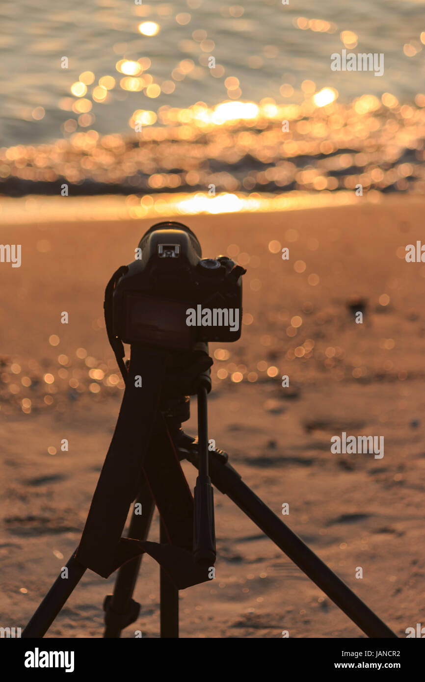 Camera on a tripod to take pictures of the sun and landscape Stock ...