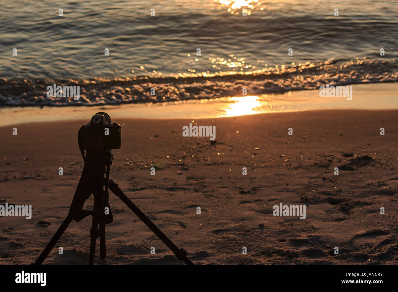 Camera on a tripod to take pictures of the sun and landscape Stock ...
