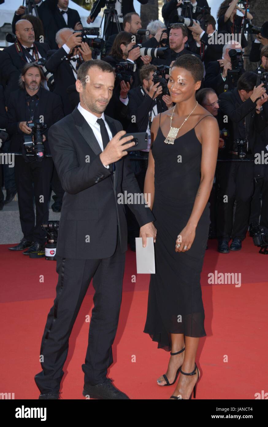 Mathieu Kassovitz (suit by Dior) and Aude Legastelois (dress by John Galliano, jewels by Montblanc)  Arriving on the red carpet for the 70th Cannes Film Festival celebrations  May 23, 2017 Photo Jacky Godard Stock Photo