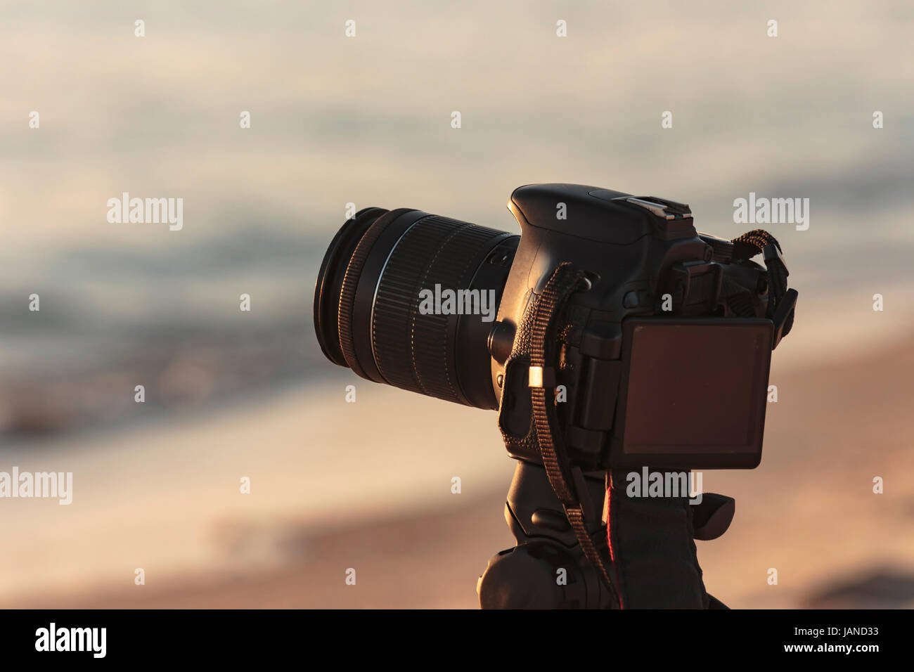 Camera on a tripod to take pictures of the sea Stock Photo - Alamy