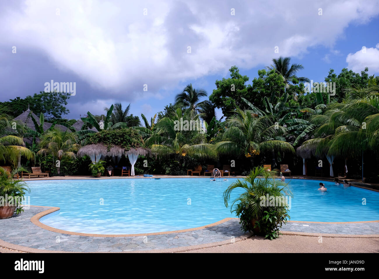 The swimming pool at the Coco Grove Beach Resort in the island of Siquijor located in the Central Visayas region of the Philippines Stock Photo