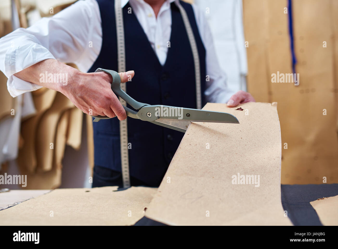 Tailor Working in Atelier Closeup Stock Photo