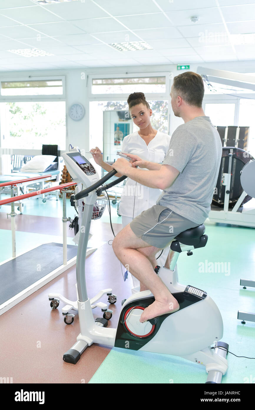 patient having physiotherapy on exercise bike in hospital Stock Photo Alamy