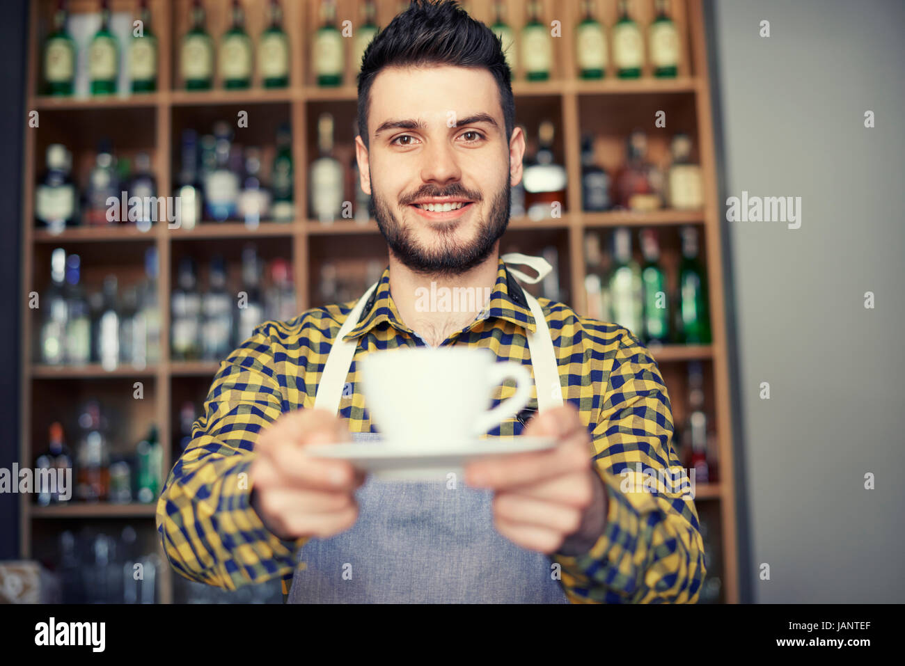 Barista selling the best coffee in town Stock Photo Alamy