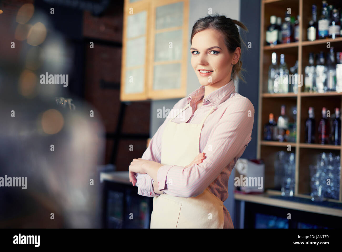 Smiling blond hair waitress during work Stock Photo Alamy