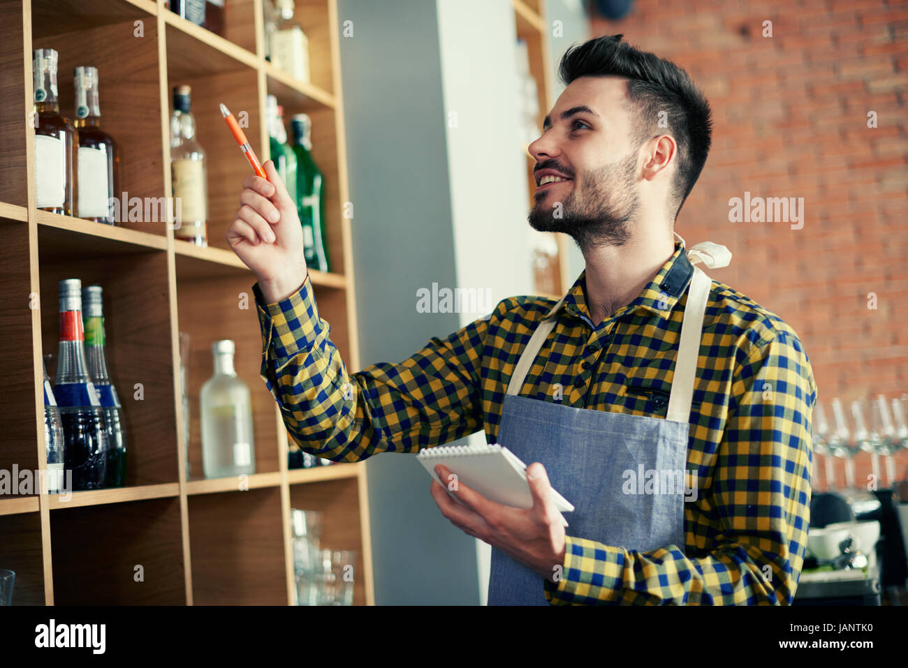 Waiter doing an orders to bar Stock Photo Alamy