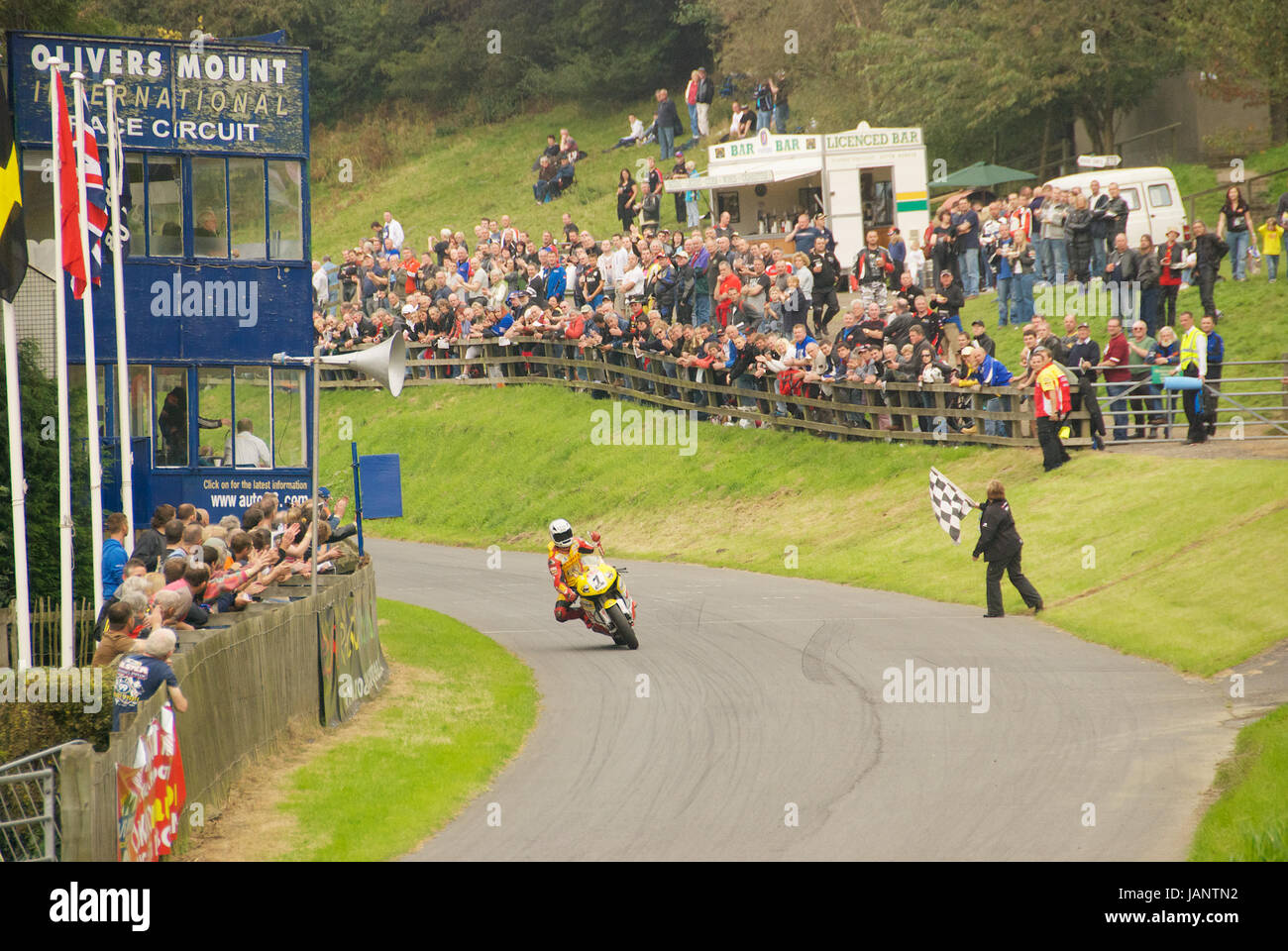 Motorcycle passing the checkered flag at Oliver's Mount Road Racing