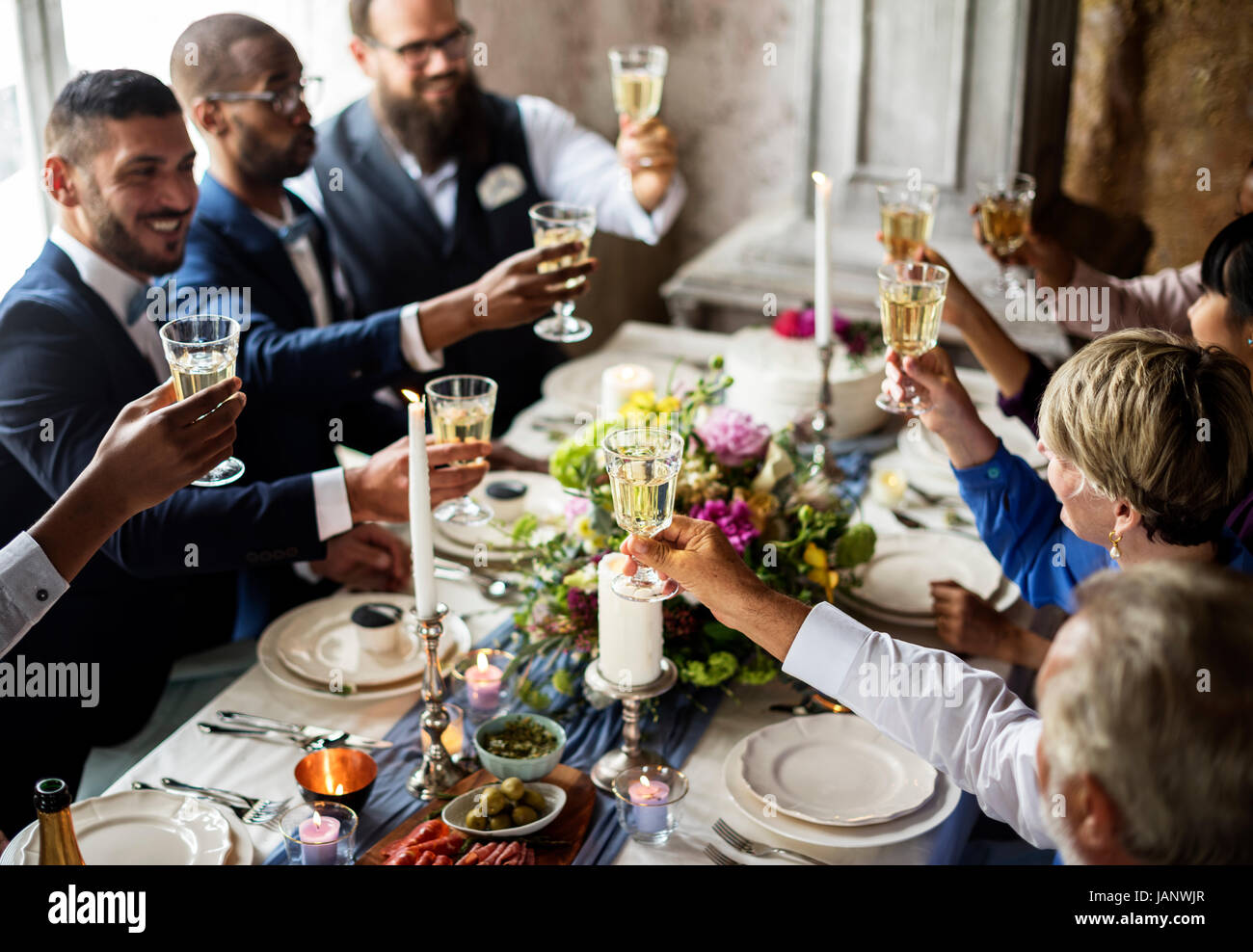 Group of Diverse People Clinking Wine Glasses Together Stock Photo
