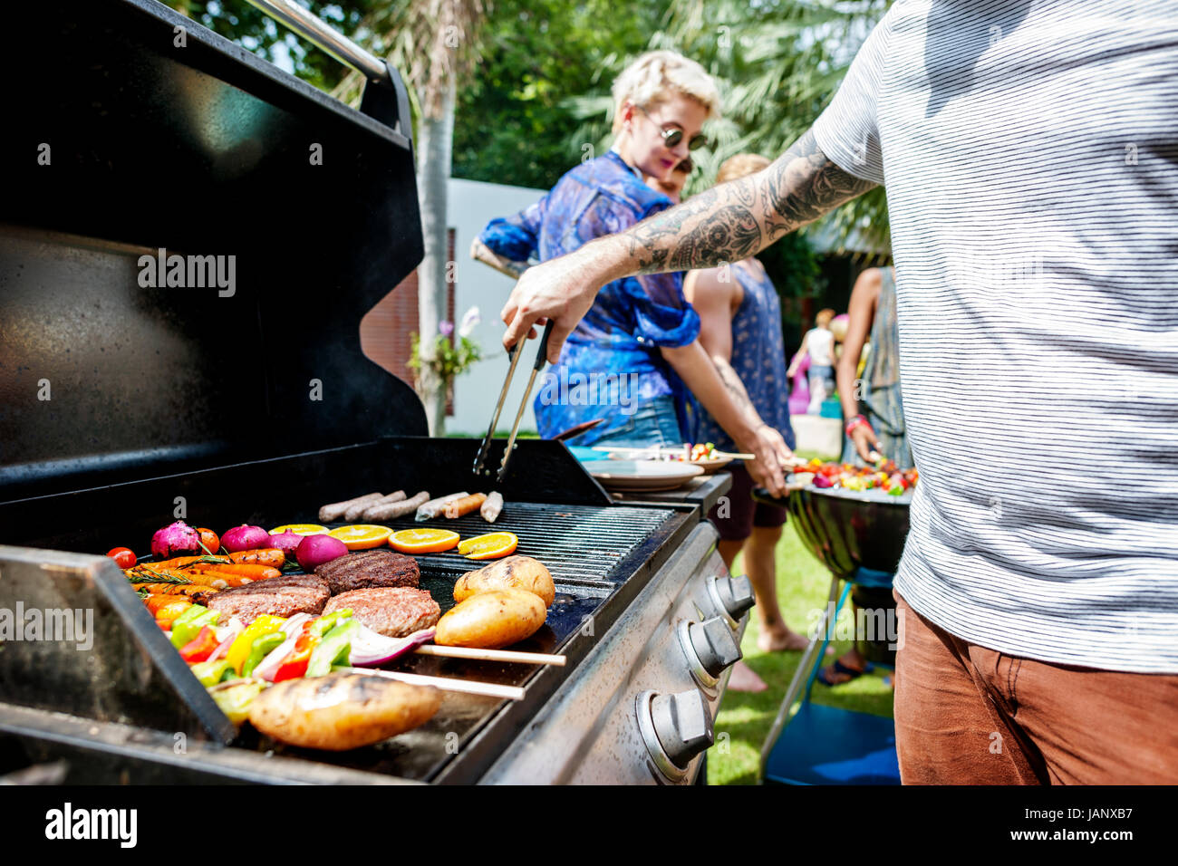 Cooking hamburger patties on the charcoals grill Stock Photo Alamy