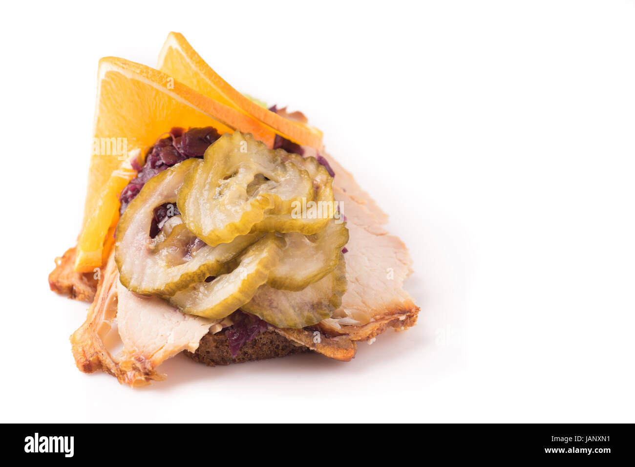 Danish specialties and national dishes, high-quality open sandwich. Roasted Pork belly and Pickled red cabbage and orange isolated on white background Stock Photo