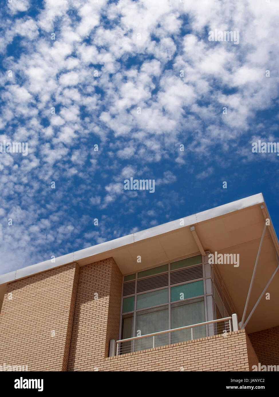 modern building against blue sky and fluffy clouds Stock Photo - Alamy