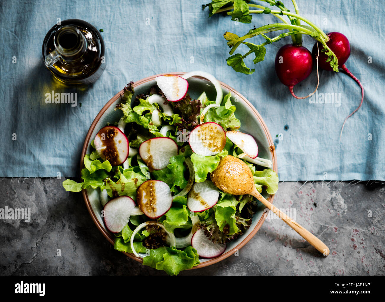 Closeup of salad bowl with dressing Stock Photo - Alamy
