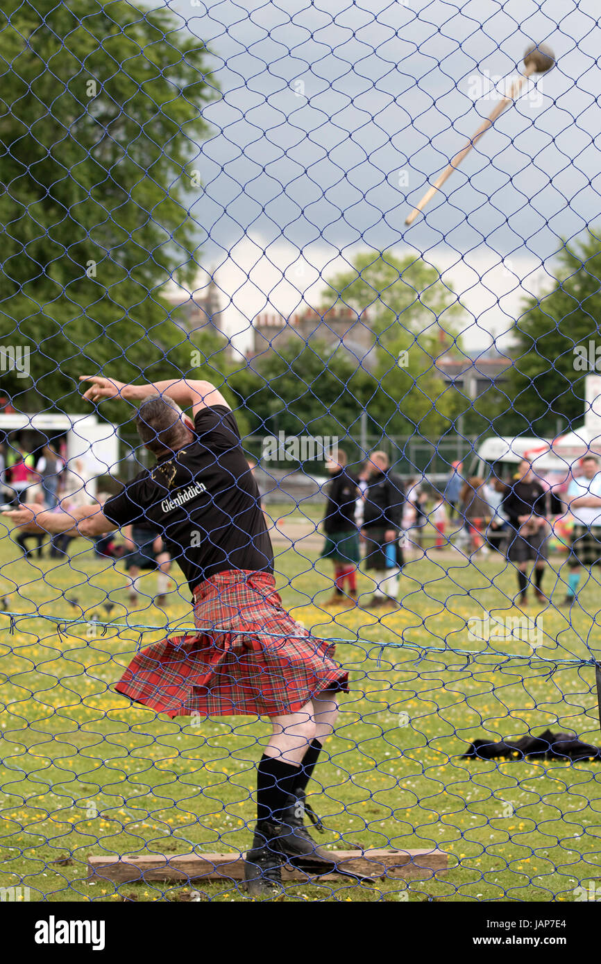 Cornhill, Scotland - 03 Jun 2017: A competitor in the Hammer Throw at the Highland Games in Cornhill, Scotland. Stock Photo