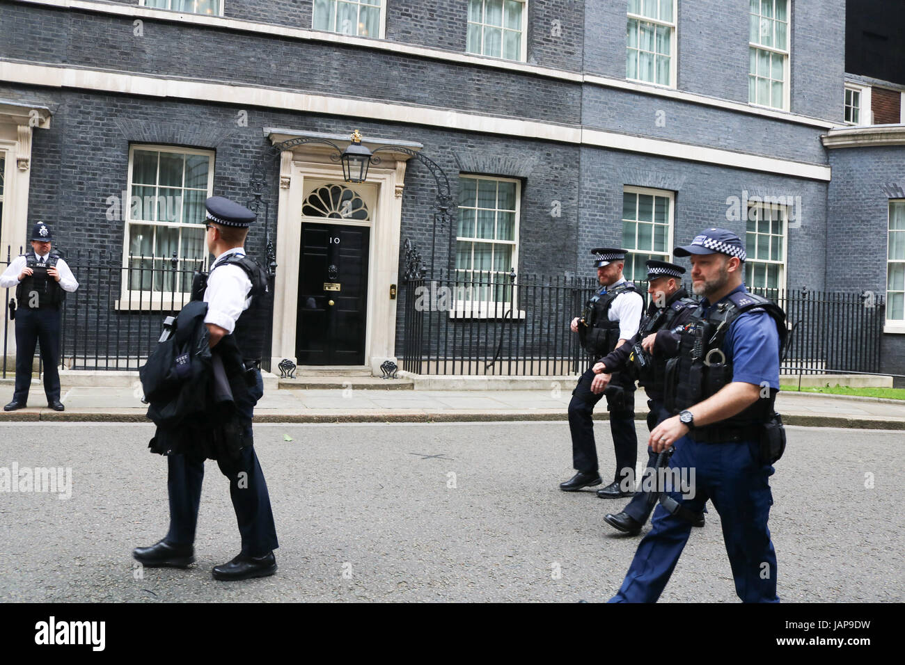 London, UK. 7th June, 2017. Armed police officers in Downing Street on the eve of the General election on June 8 when British voters go to the polls Credit: amer ghazzal/Alamy Live News Stock Photo