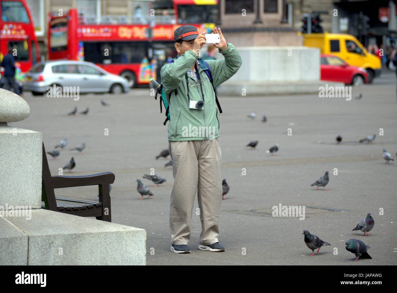 sunny weather with the chinese tourists in George Square  Glasgow Scotland Stock Photo