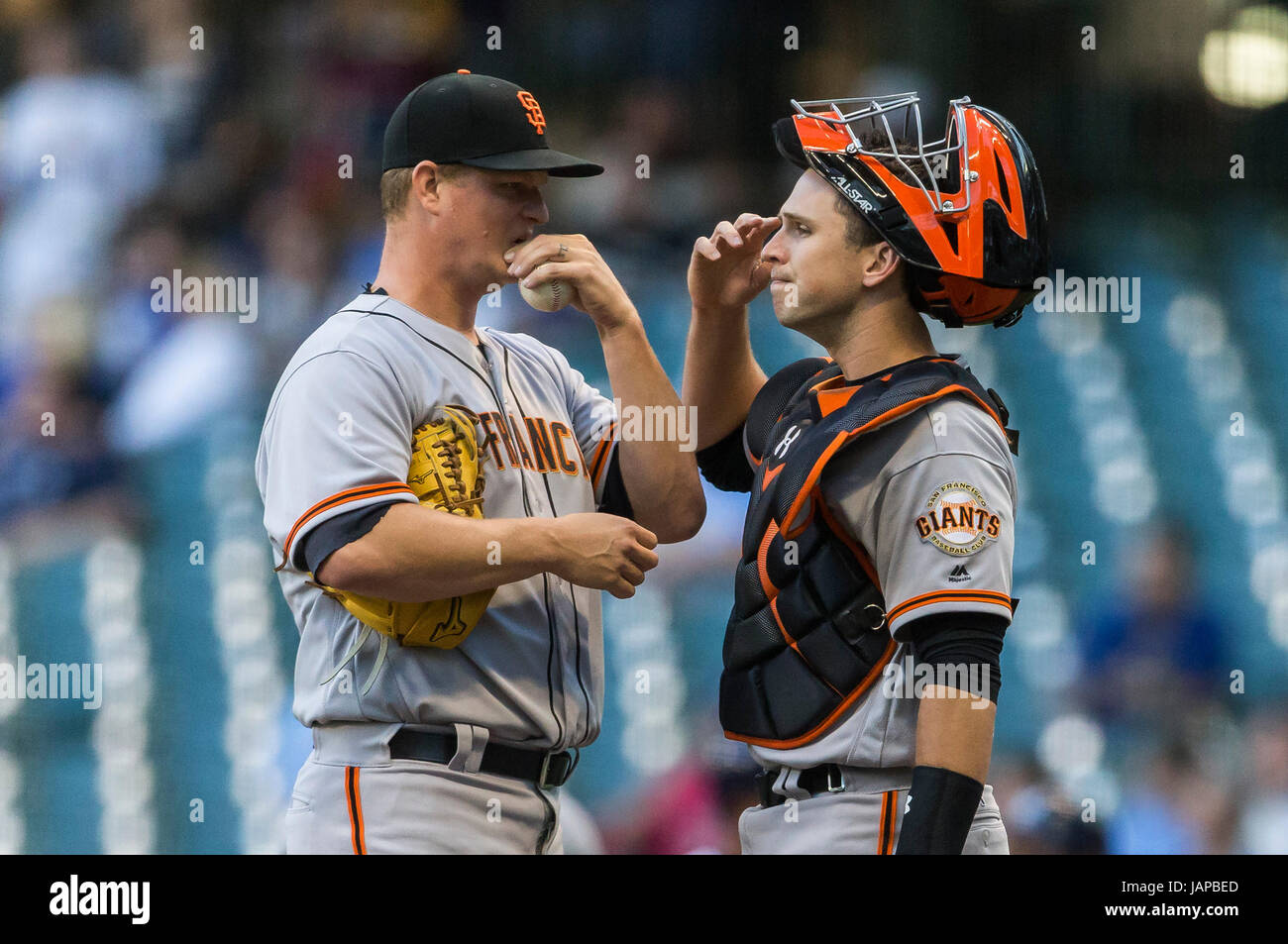 Milwaukee, WI, USA. 6th June, 2017. San Francisco Giants catcher Buster Posey #28 talks with San Francisco Giants starting pitcher Matt Cain #18 during the Major League Baseball game between the Milwaukee Brewers and the San Francisco Giants at Miller Park in Milwaukee, WI. John Fisher/CSM/Alamy Live News Stock Photo