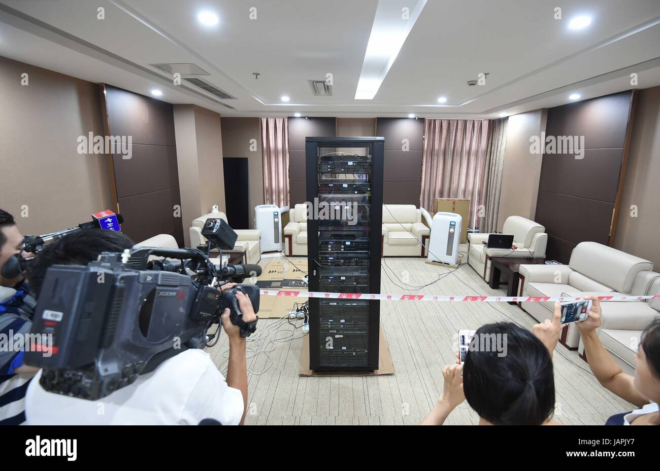 Chengdu, China. 08th June, 2017. A robot, AI-MATHS, sits for the math test of China's national college entrance exam in Chengdu, capital of southwest China's Sichuan Province, June 7, 2017. The robot, consisting of 11 servers, was developed by Chengdu Zhunxingyunxue Technology. It completed two versions of the exam's math test on Wednesday afternoon. There are several versions of the tests in different regions of China. The robot finished the Beijing test in 22 minutes, scoring 105 points out of 150 points, without Internet support. Credit: Xinhua/Alamy Live News Stock Photo