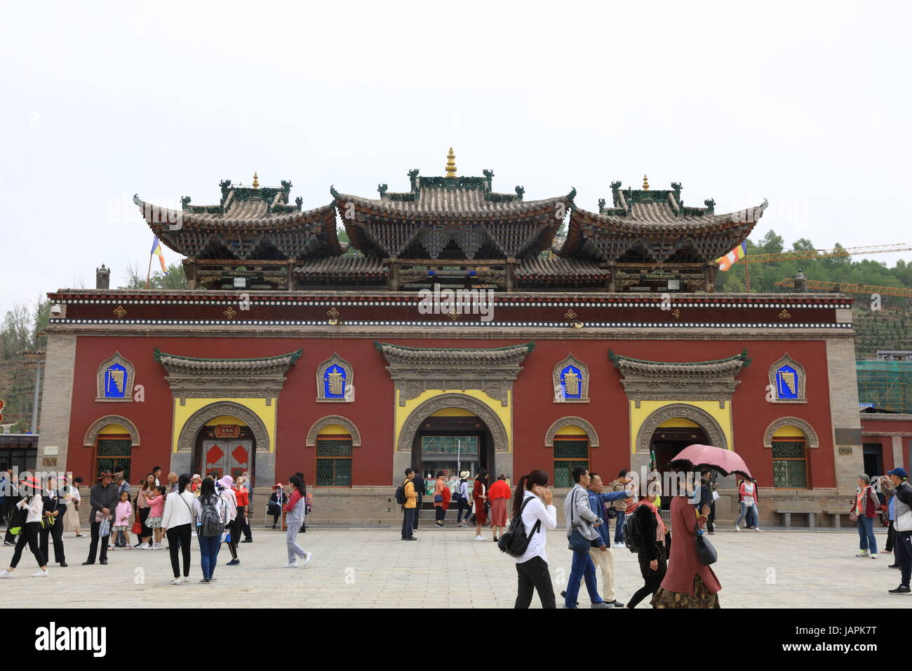 Xining, Xining, China. 7th June, 2017. Xining, CHINA-June 7 2017: (EDITORIAL USE ONLY. CHINA OUT) .The Tar Monastery, one of the six most important monasteries of the Gelukpa (Yellow Hat) school of Tibetan Buddhism, is a large complex featuring dozens of halls and towers on a mountainside in both Tibetan and Han architectural styles. Located in Huangzhong County, 25 kilometers from Xining, northwest China's Qinghai Province, the monastery was built in 1560 in honor of the founder of Gelukpa School, Tsongkhapa. It's known for its many butter sculptures, mural paintings and barbolas which fully Stock Photo