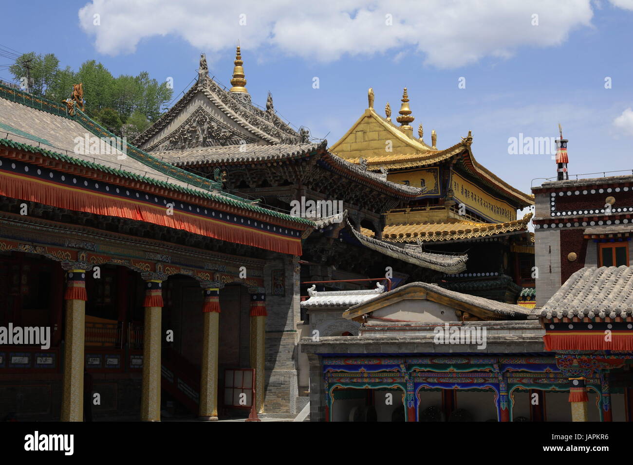 June 7, 2017 - Xining, Xining, China - Xining, CHINA-June 7 2017: (EDITORIAL USE ONLY. CHINA OUT) ..The Tar Monastery, one of the six most important monasteries of the Gelukpa (Yellow Hat) school of Tibetan Buddhism, is a large complex featuring dozens of halls and towers on a mountainside in both Tibetan and Han architectural styles. Located in Huangzhong County, 25 kilometers from Xining, northwest China's Qinghai Province, the monastery was built in 1560 in honor of the founder of Gelukpa School, Tsongkhapa. It's known for its many butter sculptures, mural paintings and barbolas which fully Stock Photo