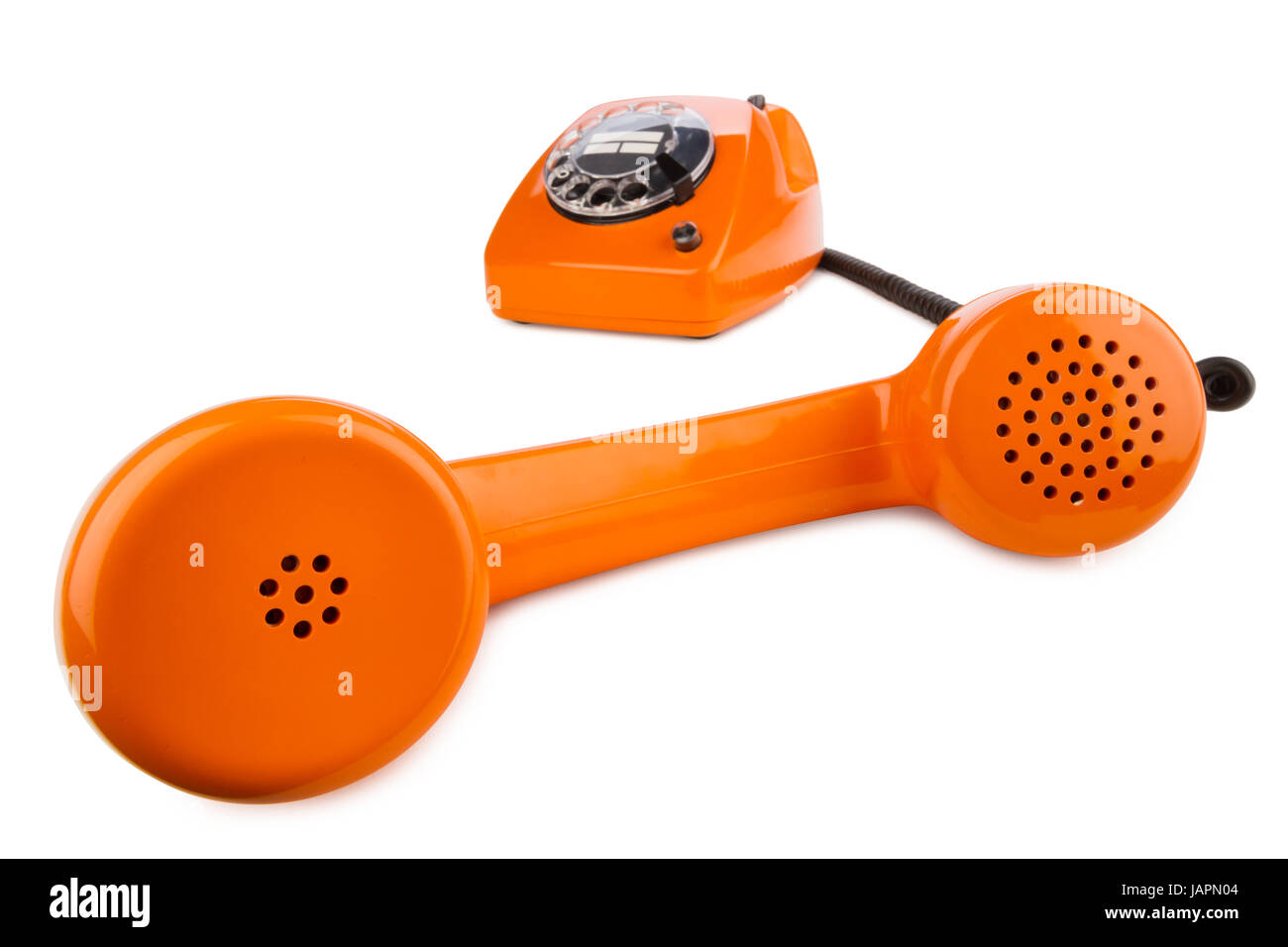 altes retro telefon mit wahlscheibe in orange Stock Photo
