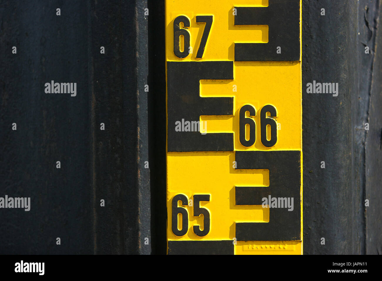 Water level indicator by a river Stock Photo Alamy