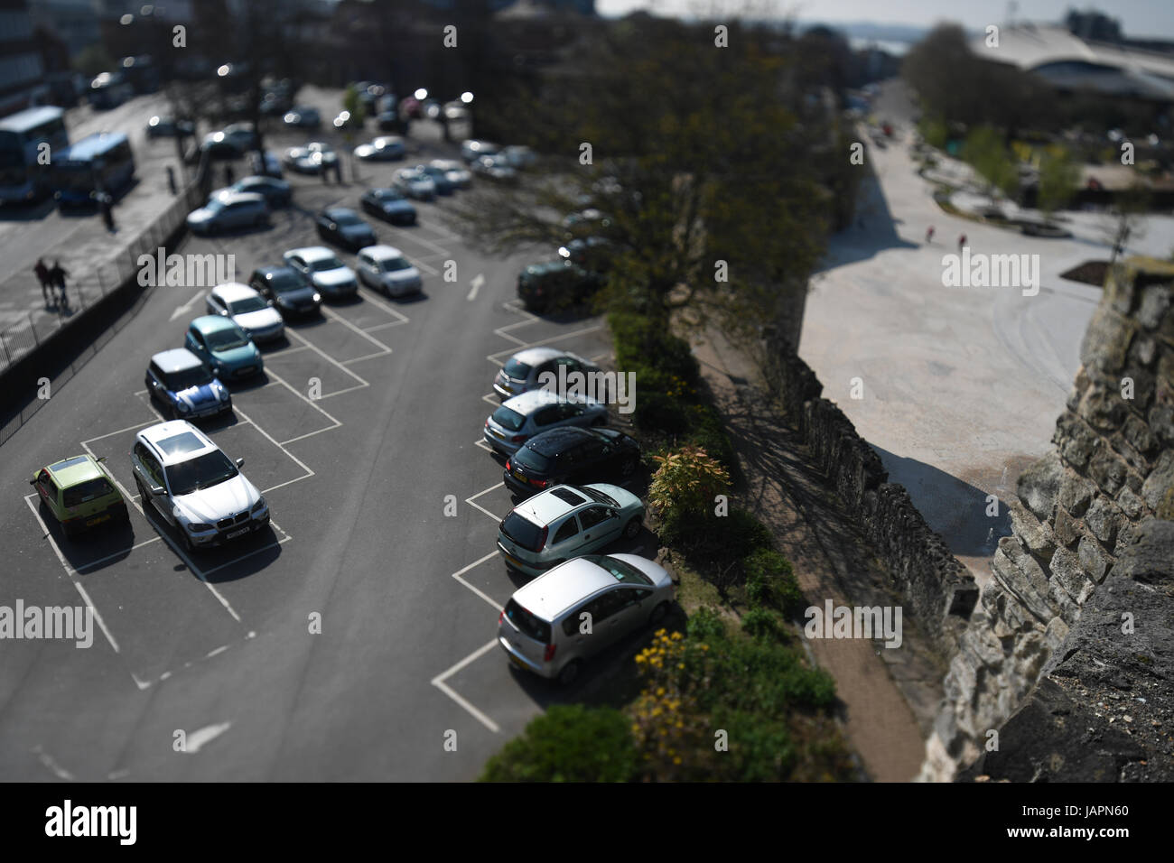 A photograph of a car park using a Tilt-shift lens to change the  focal plane and great the creative effect Stock Photo