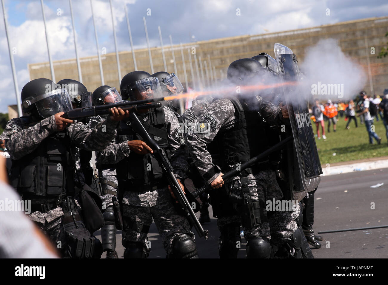 Military policeman fire rubber bullets at anti-government rioters attacking the government center during protests demanding the resignation of President Michel Temer May 24, 2017 in Brasilia, Brazil.   (photo by Marcelo Camargo/Agency Brasil via Planetpix) Stock Photo
