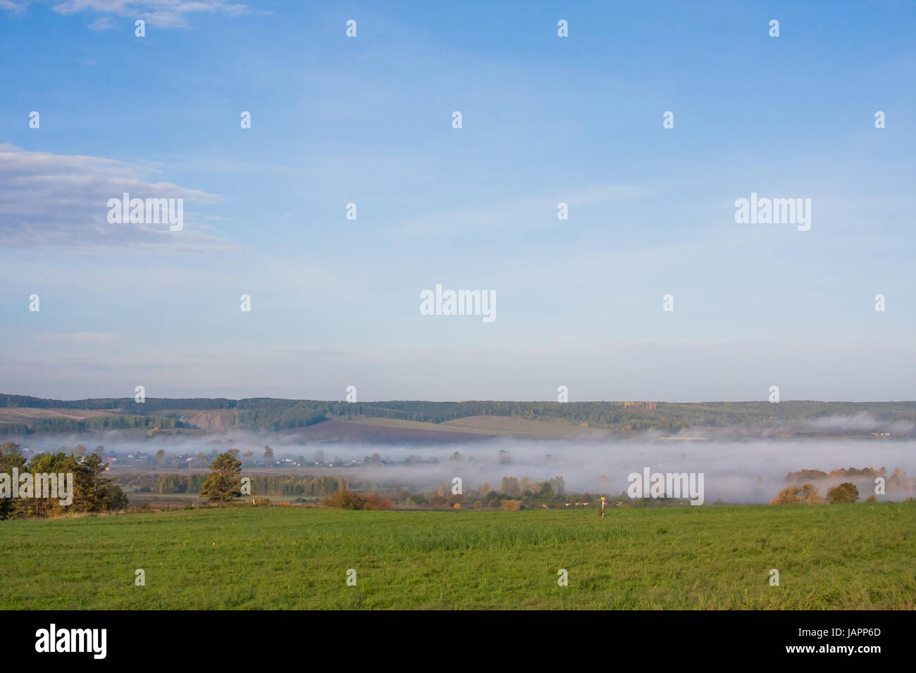 Perm, Russia - Fog over the village early in the morning Stock Photo ...