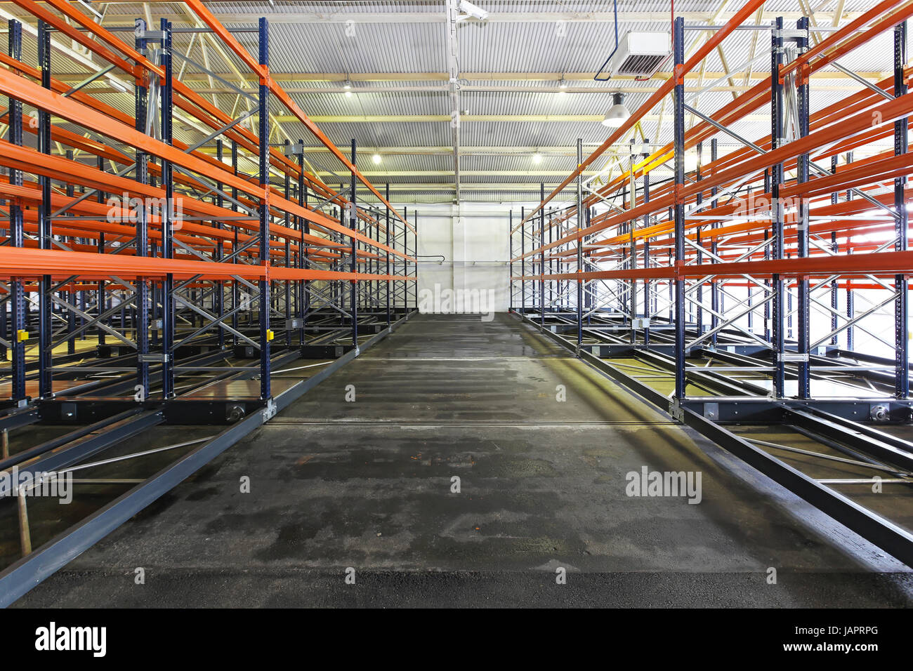 Empty shelves and racks in distribution warehouse Stock Photo - Alamy
