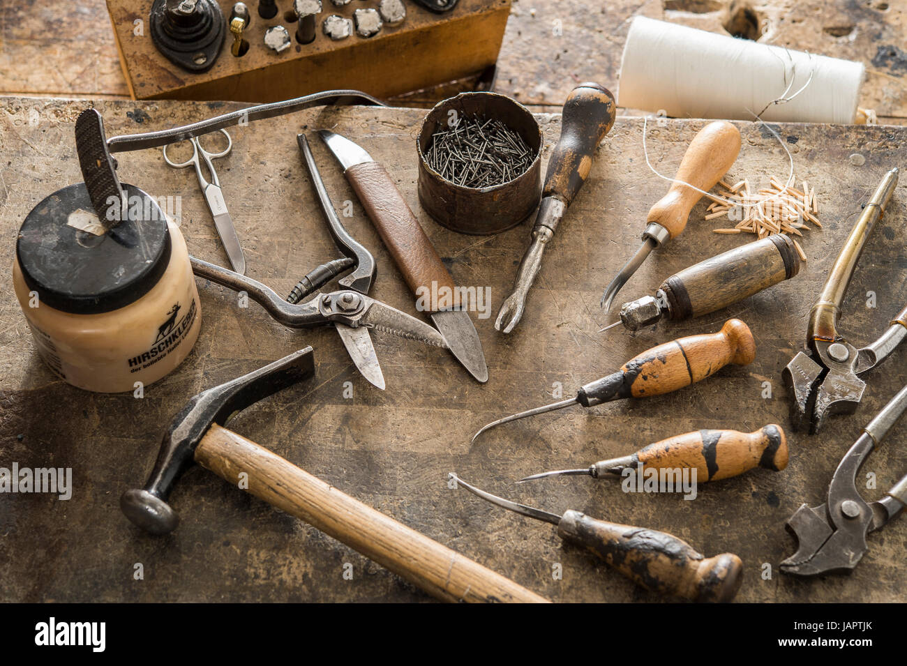Shoemaker, various tools on work table, Kainisch, Styria, Austria Stock