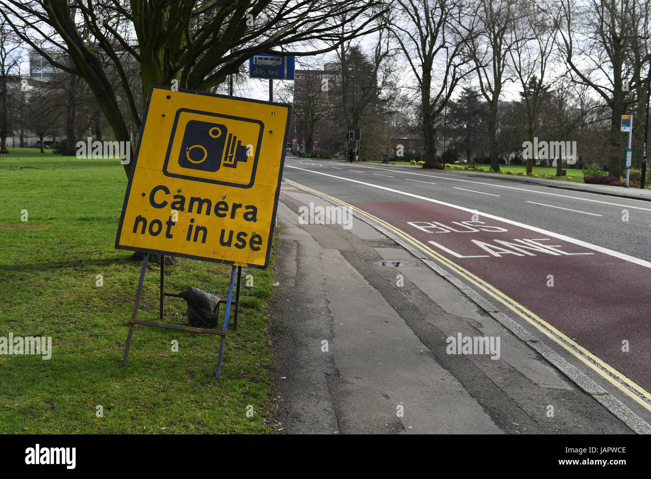 Bus lane traffic camera not in use sign Stock Photo