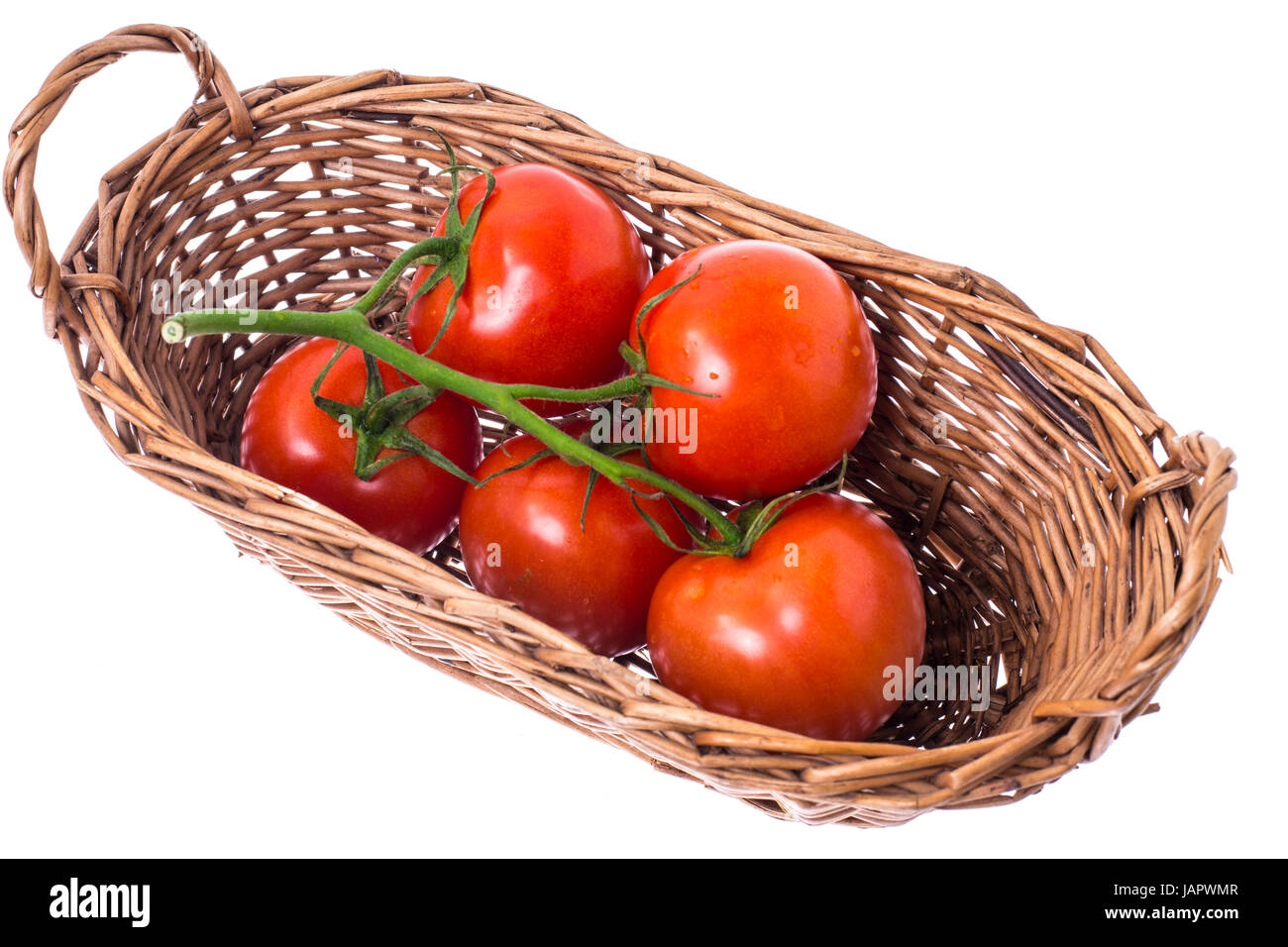Tomatoes in basket on white Stock Photo - Alamy